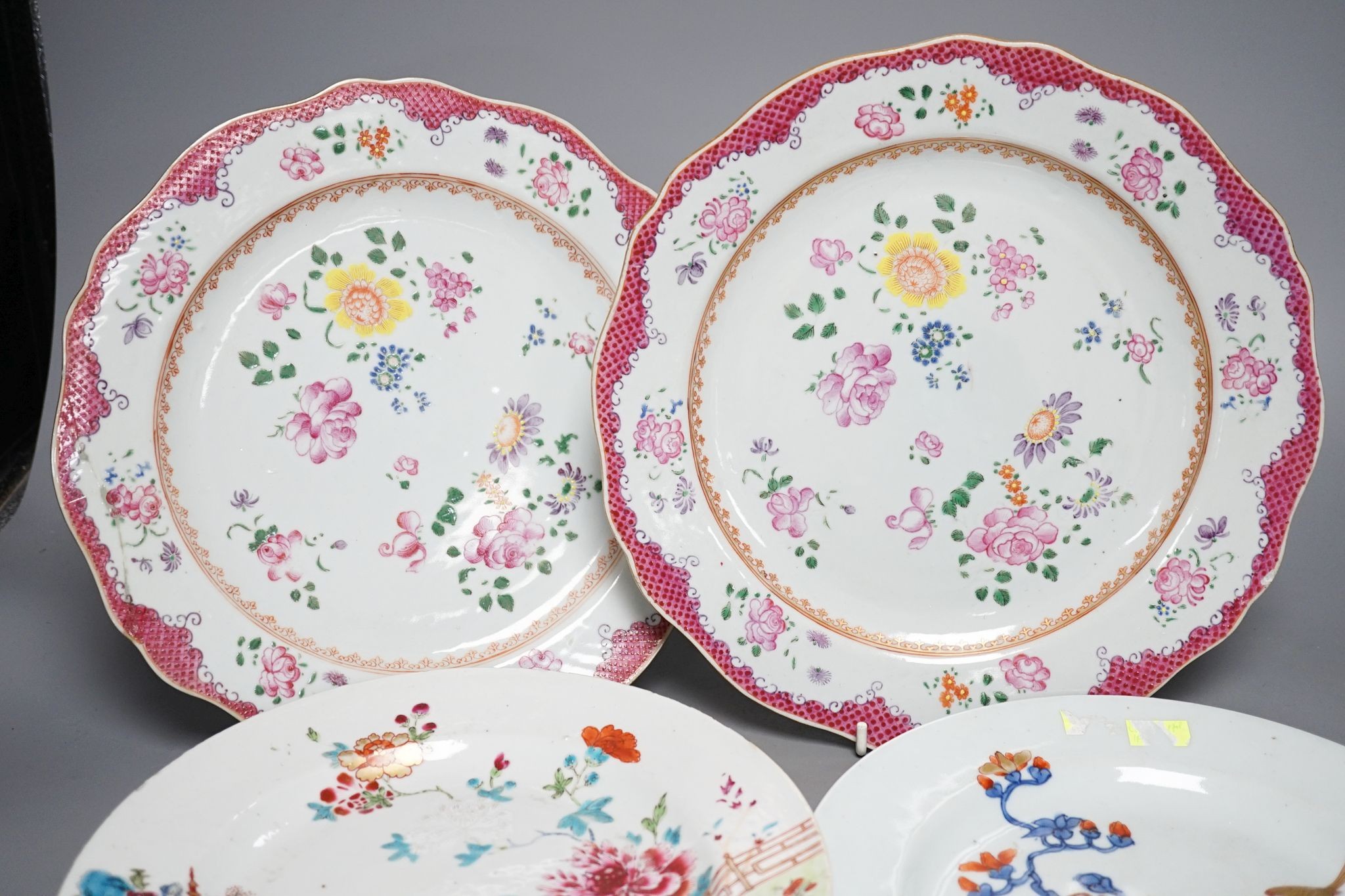 Two pairs of 18th century Chinese famille rose plates and an Imari plate, 26cm